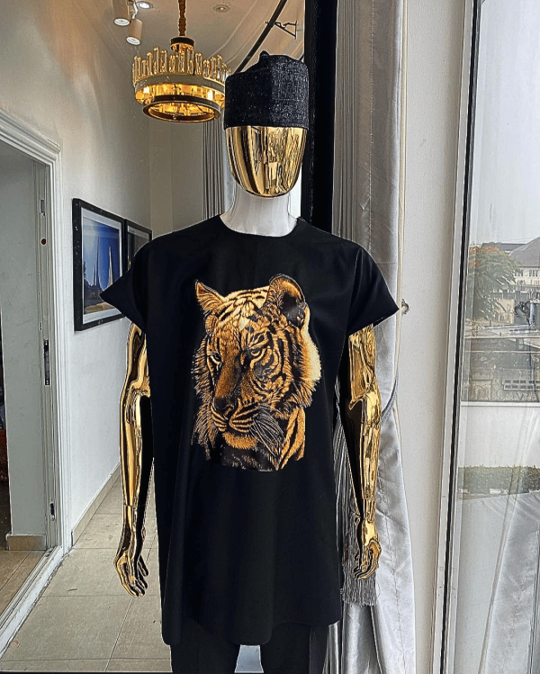A charcoal black daftan with a tiger prints & black Fulani hat