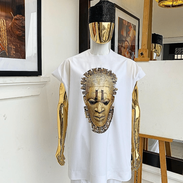 A white daftan with the Benin royalty prints and black Fulani hat
